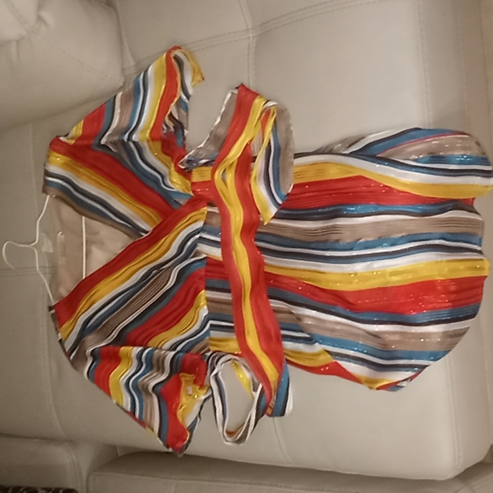 Colorful dress with undergaurd underneath, piece of fabric around waist to tie .